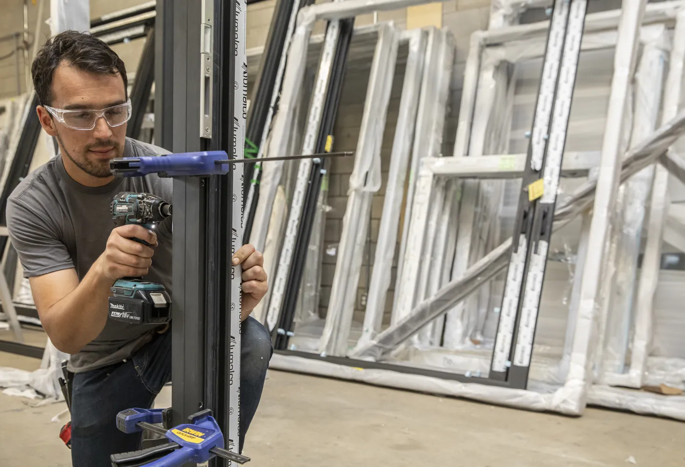 Technician assembling an aluminum door
